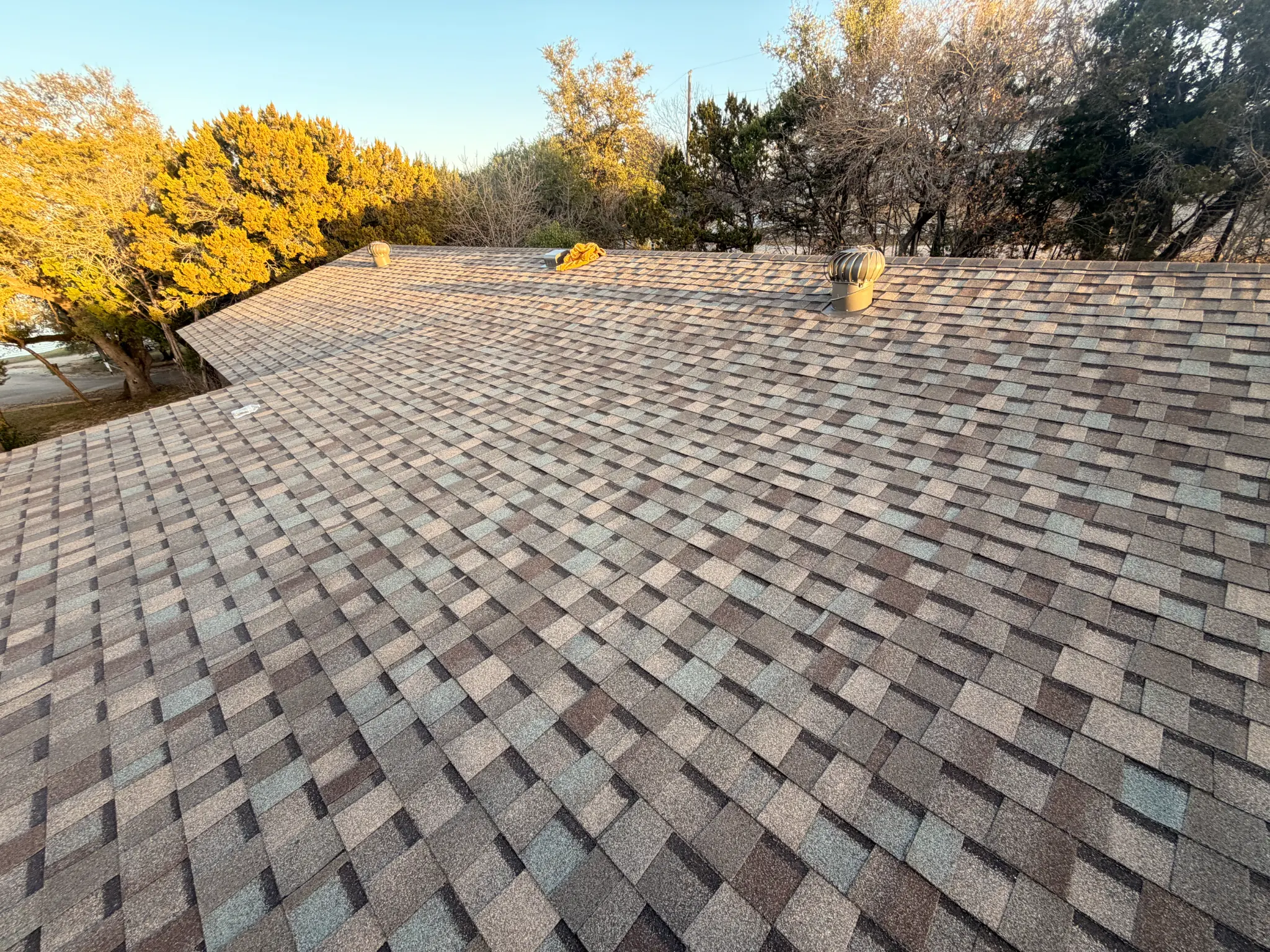 Aerial view of a completed roof installation in Granbury TX