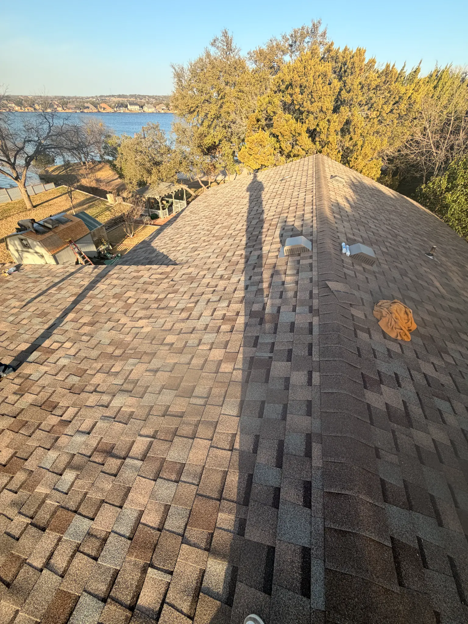 Completed roof replacement on a Granbury TX home overlooking the lake