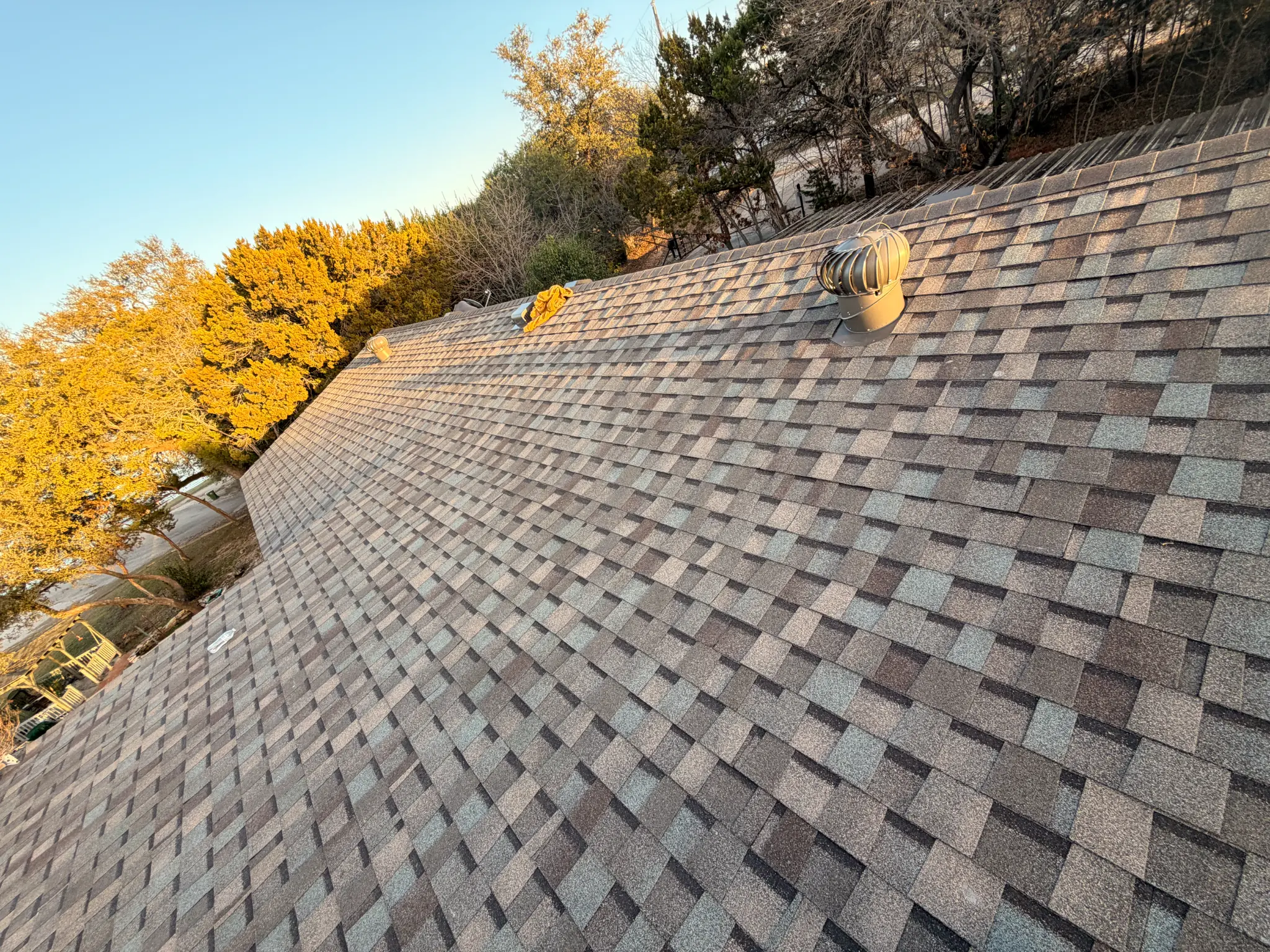 Completed roof with new vent installation in Granbury TX