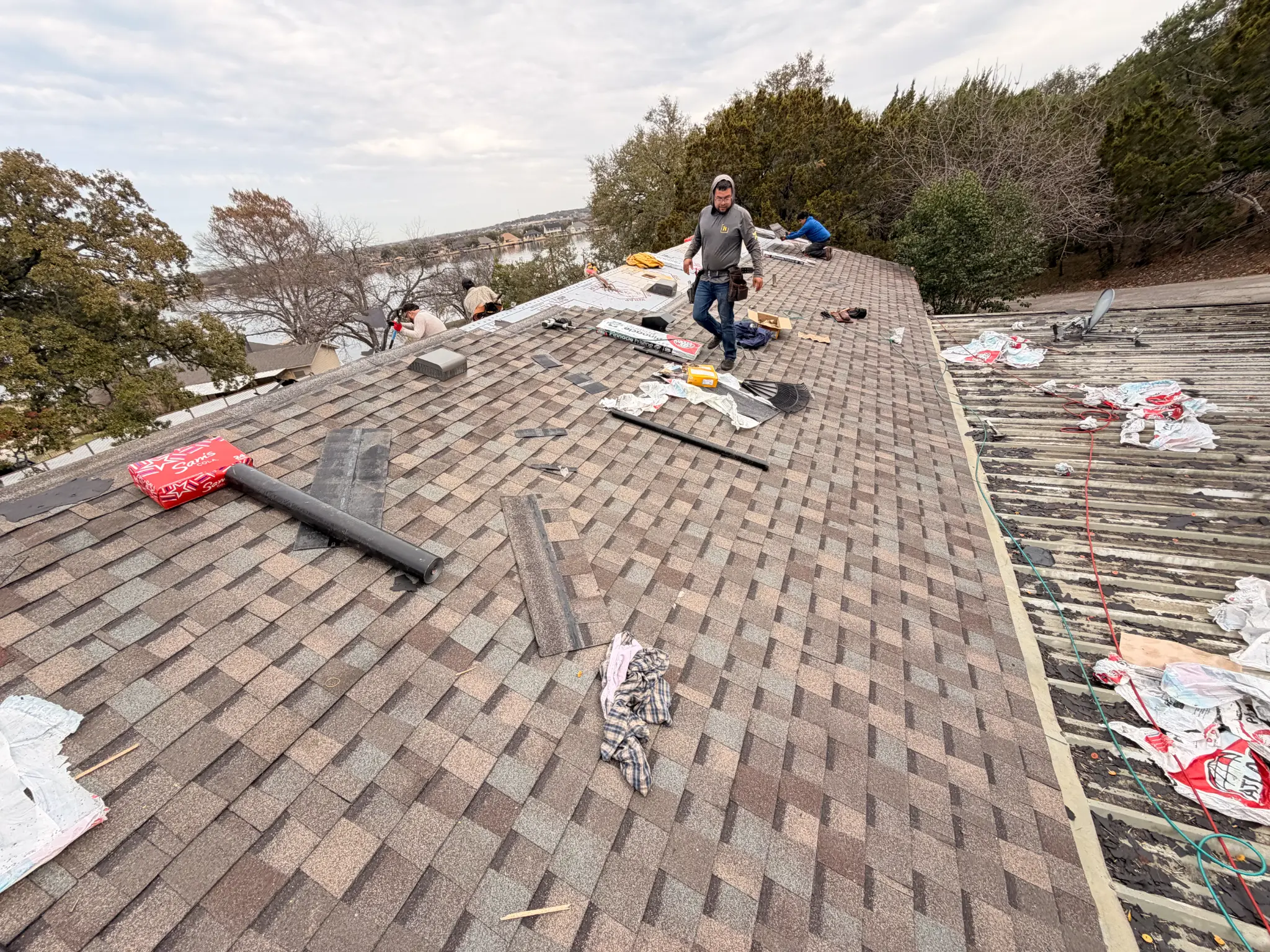 Roof installation in progress on a Granbury TX home